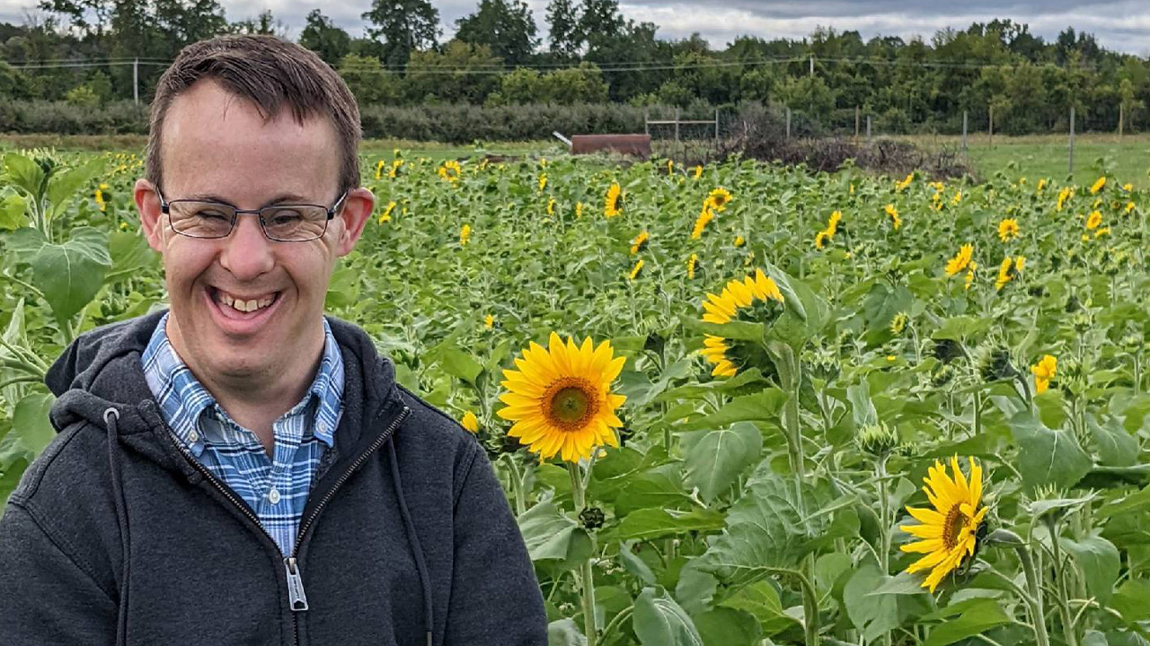 Individual with Sunflowers